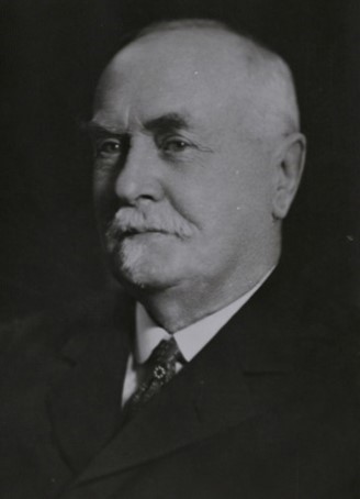 A black & white portrait of war memorial architect Sir Reginald Blomfield.