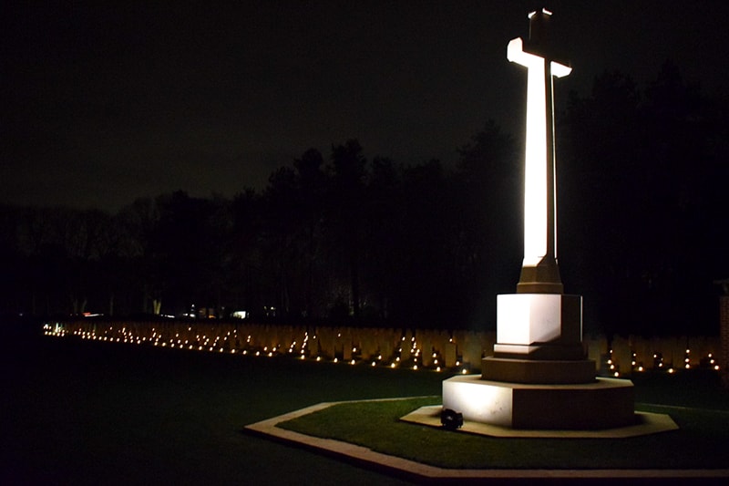 Bergen Op Zoom War Cemetery cross of sacrifice lit at night