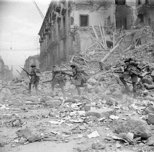 British troops fight through urban rubble during the invasion of Sicily.