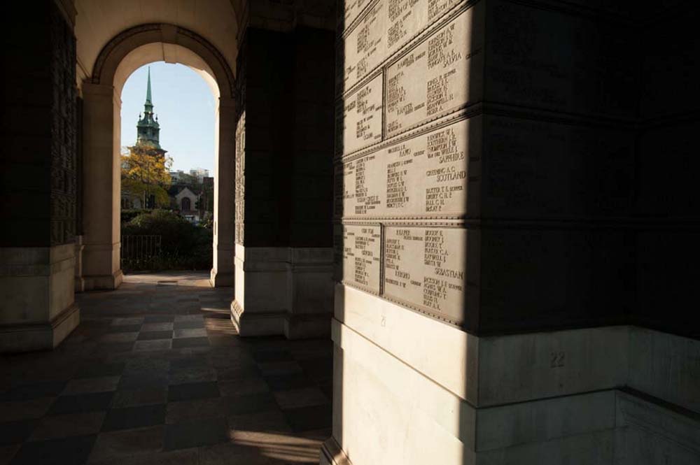 Shot of a tower through the vaulted archway of the Tower Hill Memorial.