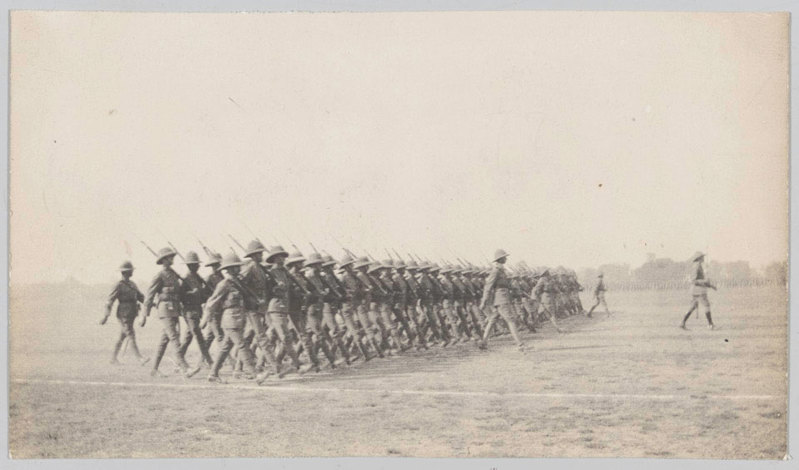 A column of British WW1 troops marching in formation during a victory parade in November 1918.