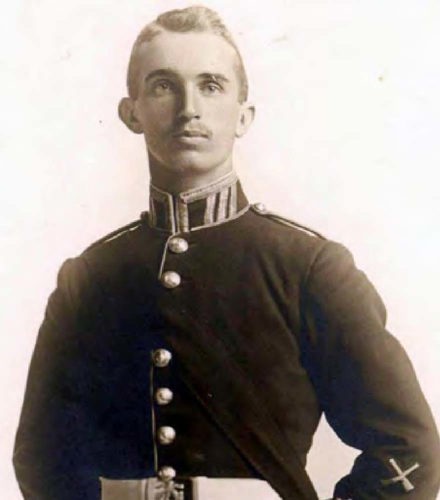 Headshot of Lt. Alexis Helmer in military dress uniform including a brass-buttoned tunic with brocade and epaulettes.
