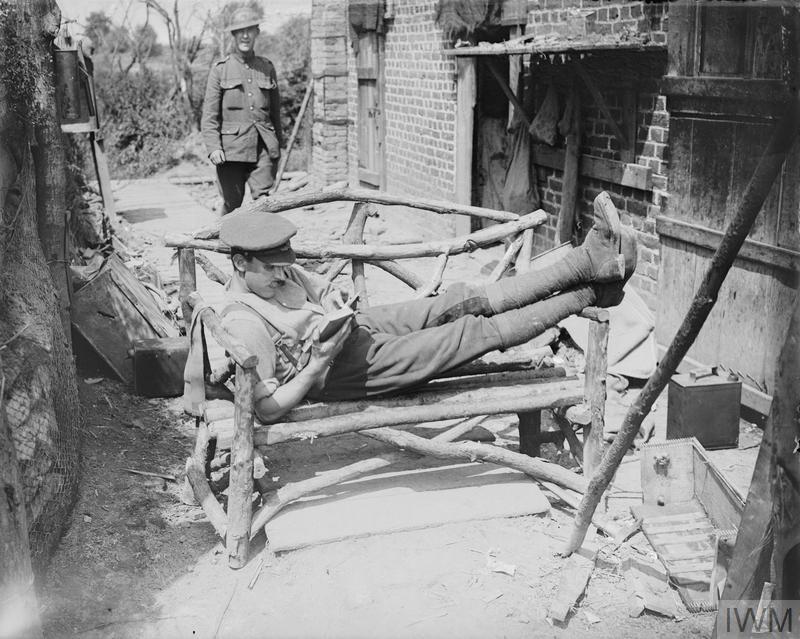 British Soldier Relaxes With A Book On The Western Front © IWM Q 5703