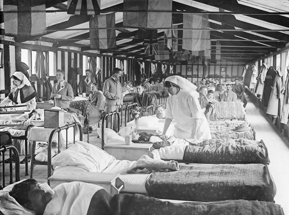 Patients and nurses in a ward of the Eastern General Hospital located in a hut on the playing fields of King’s and Clare colleges during the First World War.