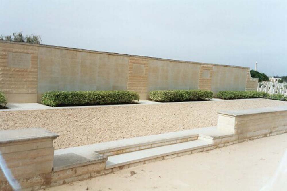 Close up of the Alamein Memorial showing its stepped platform and shrubbery at the base of the name panels.