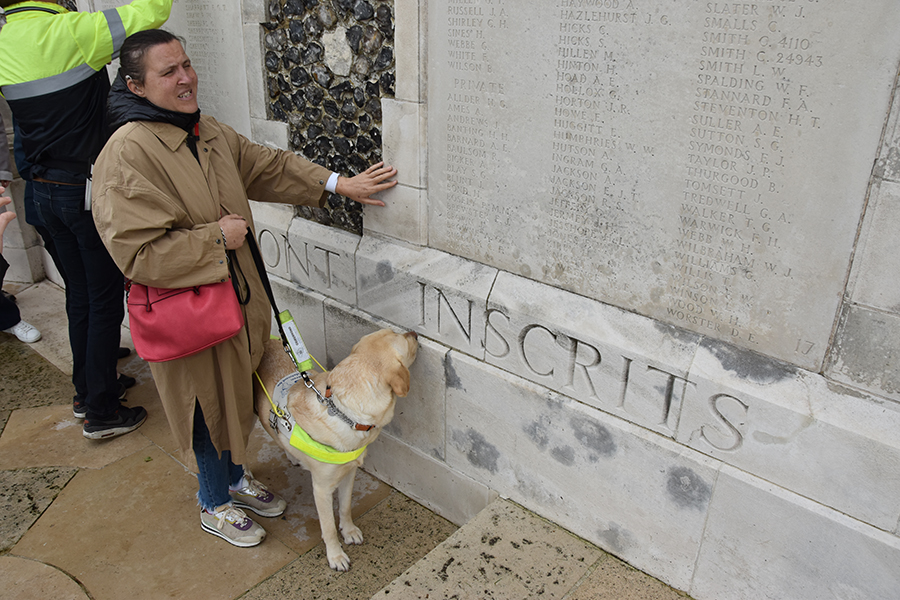 Visitor with guide dog at Tyne Cot Memorial