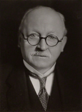 A black & white portrait of war memorial architect Sir Edwin Lutyens