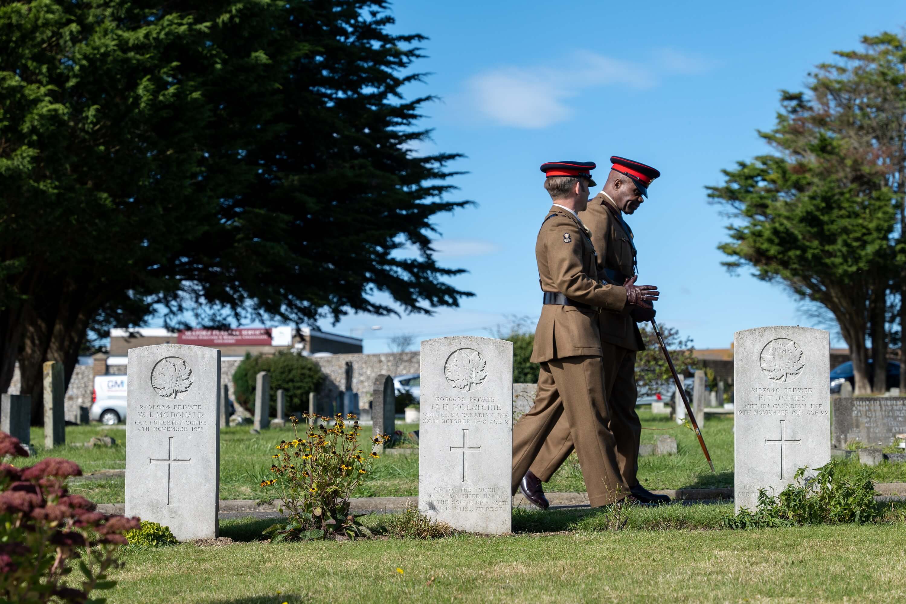 Army personnel walking around Seaford Cemetery