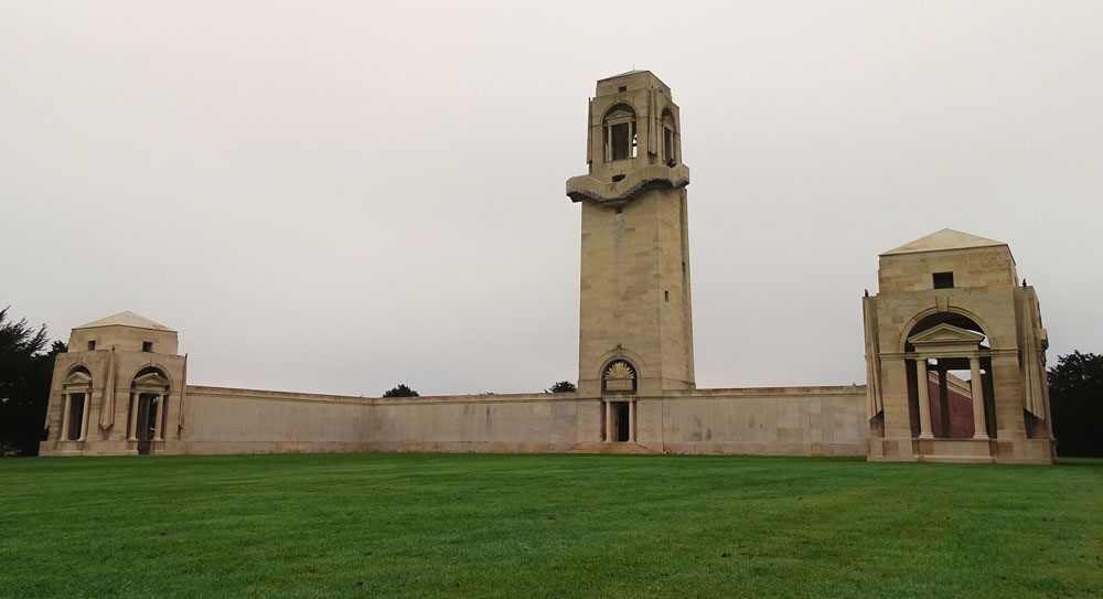 Villers-Bretonneux Memorial with its core central tower and two wings in focus.