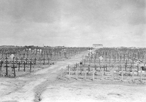 Tyne Cot Cemetery c.1920. Wooden crosses mark the graves, and the central bunker can be clearly seen at the heart of the cemetery